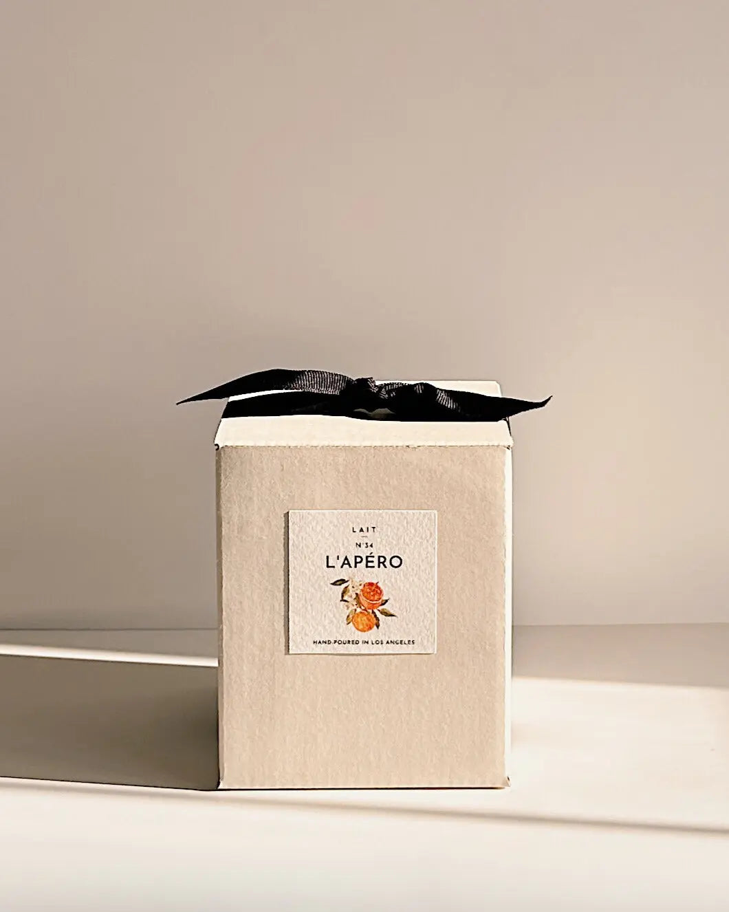 N°34 L’APÉRO (APEROL SPRITZ CANDLE) 2-WICK CANDLE SHOP LAIT