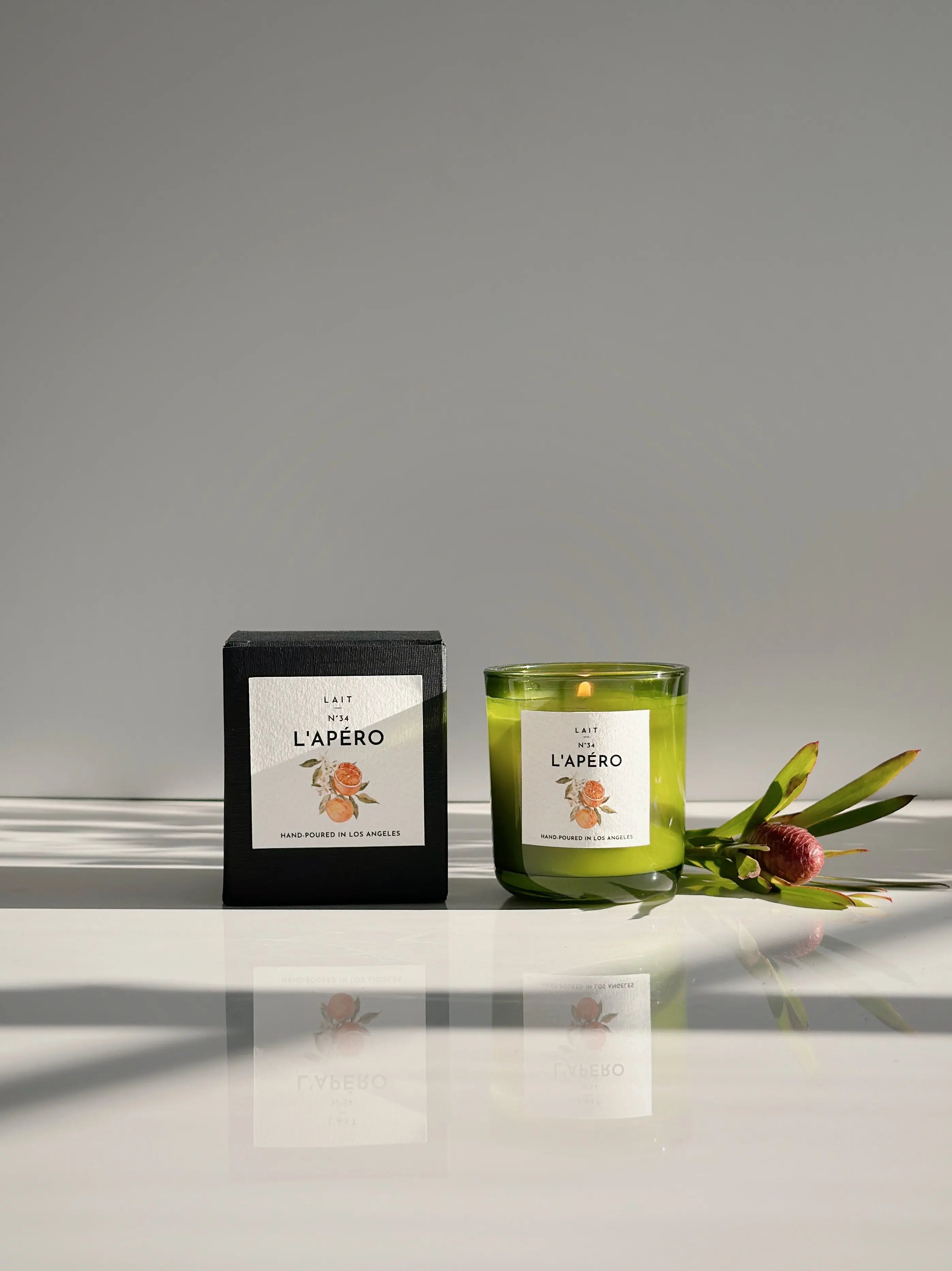 N°34 L’APÉRO (APEROL SPRITZ) PETITE BOXED CANDLE (3.5OZ) SHOP LAIT